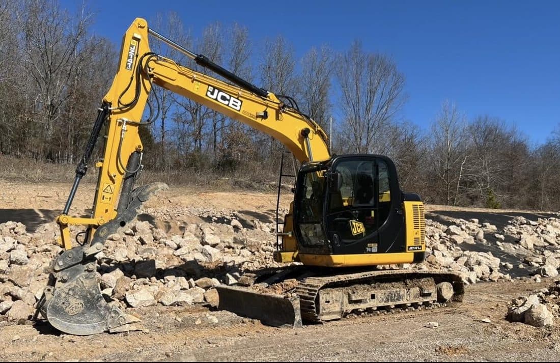 Excavator parked on a rock pad